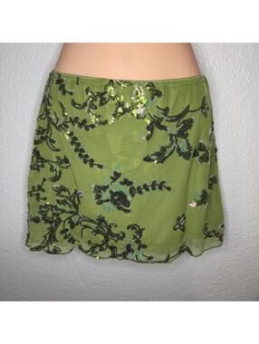 Green beaded mini skirt with black floral embroidery and sequins